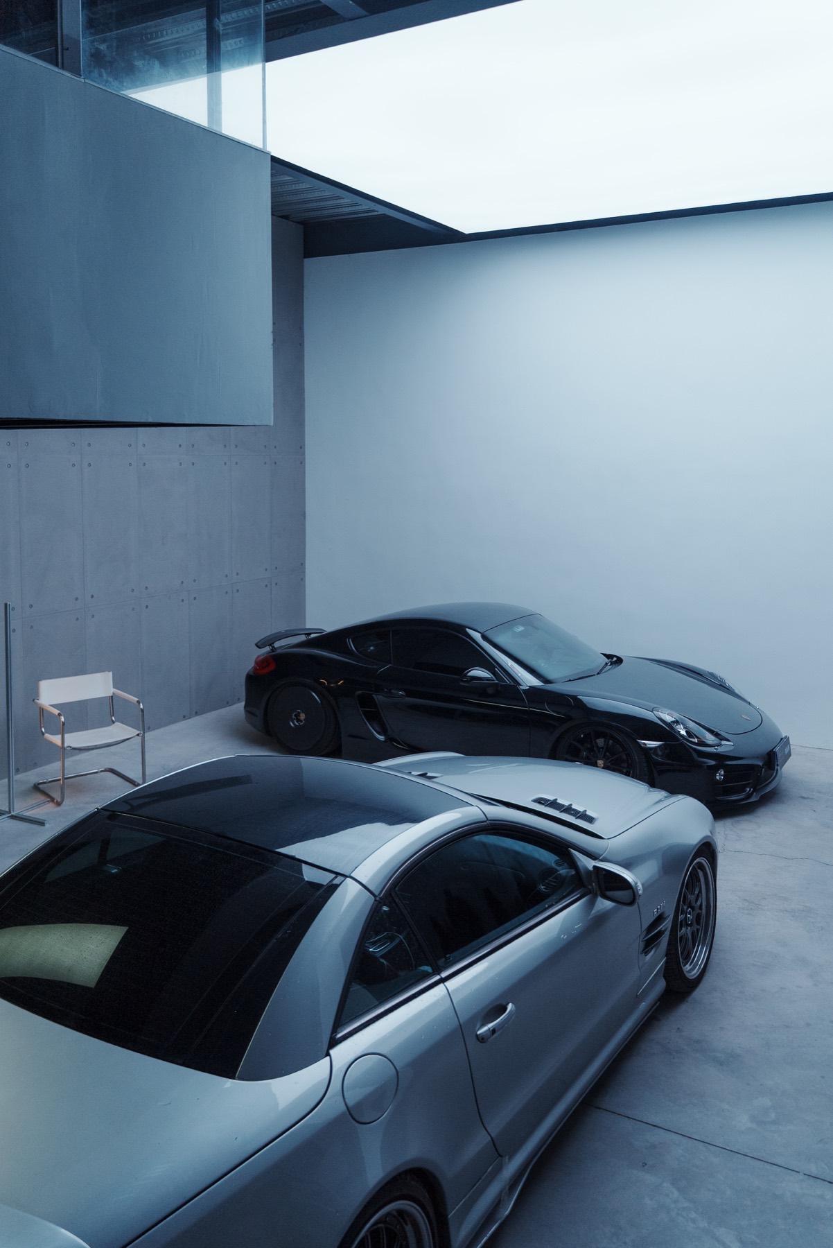 Black and silver cars inside RAWstudio garage
