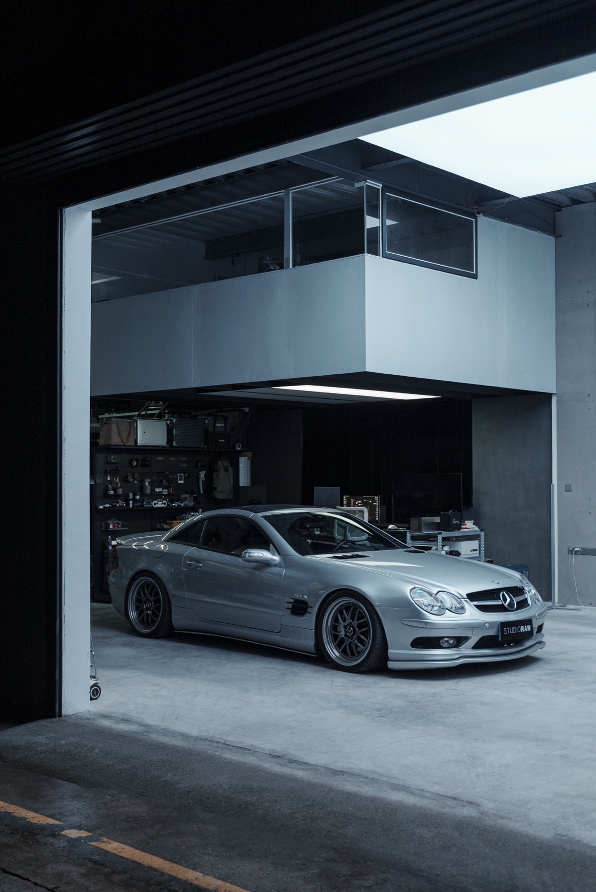 Silver Mercedes framed by RAWstudio garage door